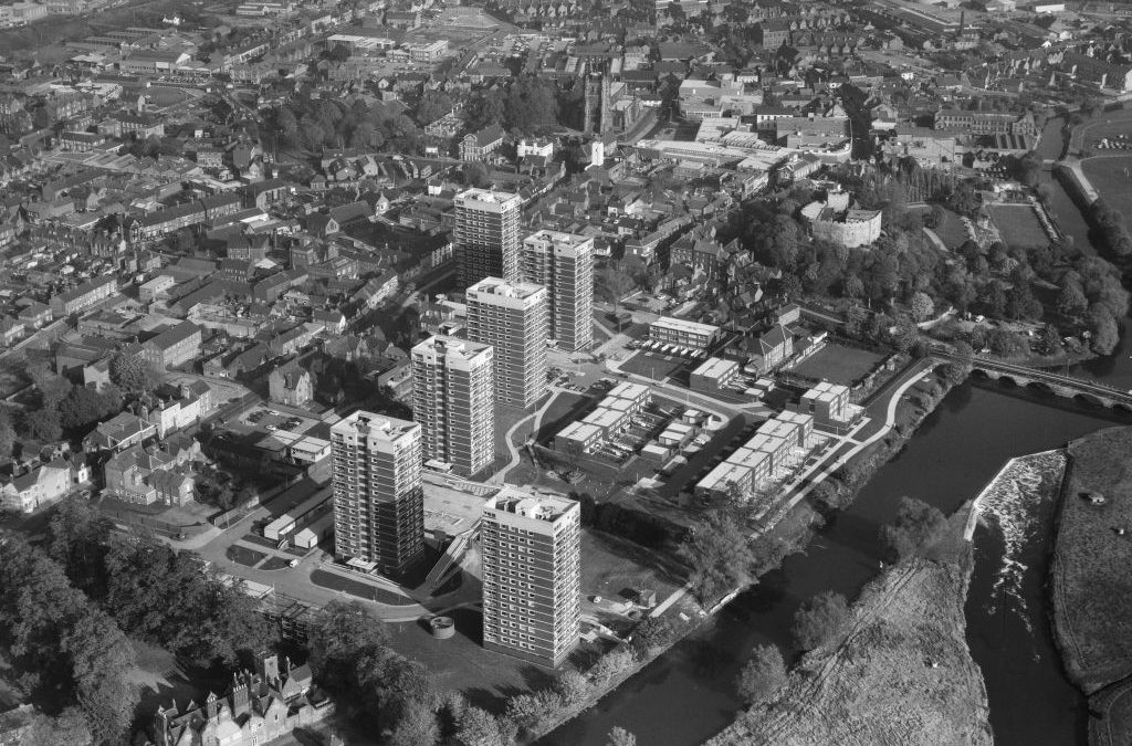 Aerial view of Tamworth, Staffordshire, from the south west. A black and white image showing a town by a river with several large tower blocks in the centre of the frame.